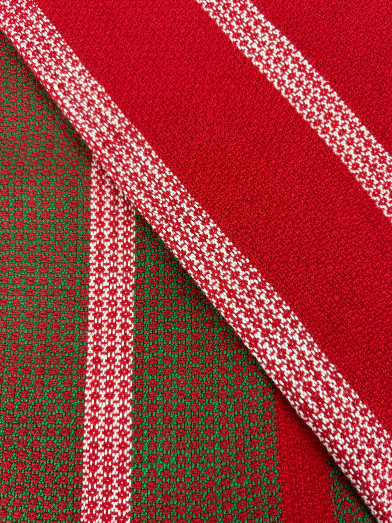 Close-up of red, green, and white towel  with diamond pattern