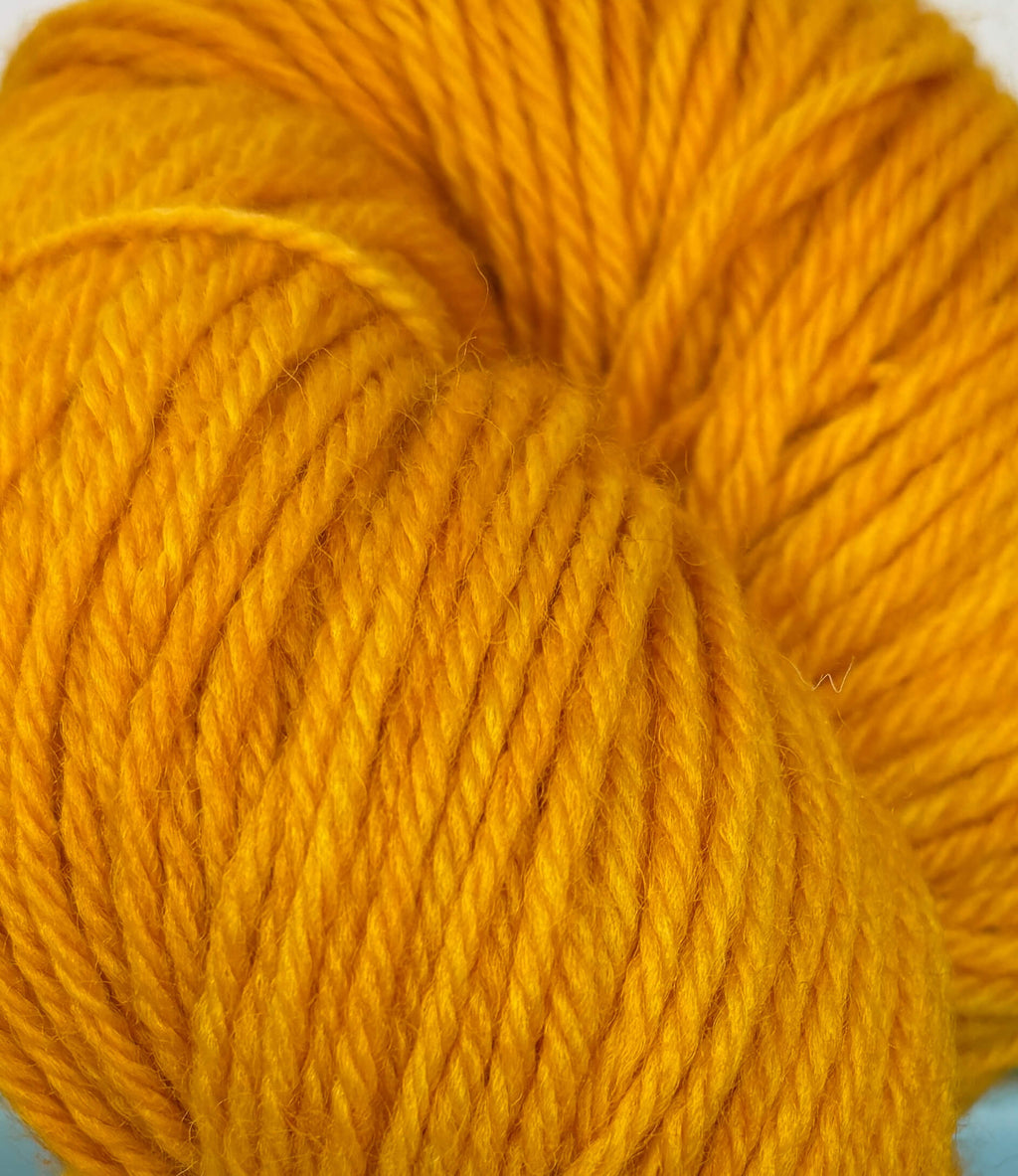 Close-up of a ball of bright orange yarn