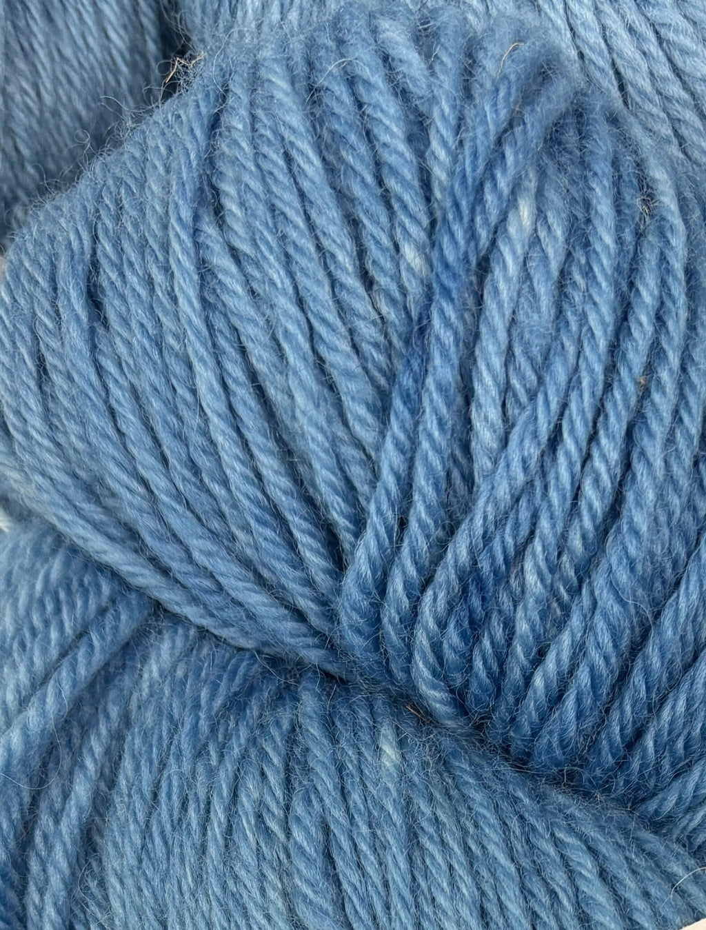Close-up of blue yarn with visible texture