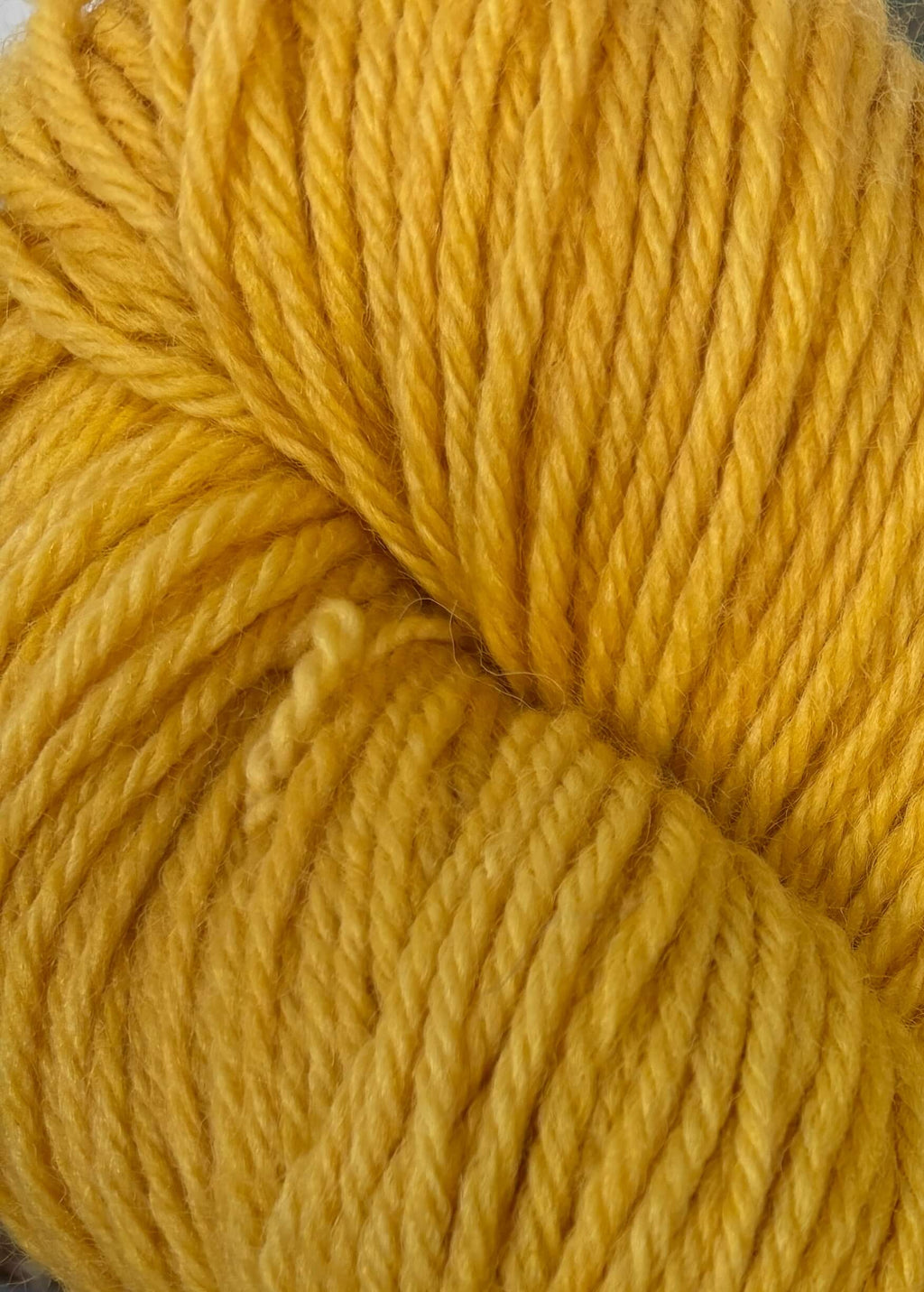 Close-up of a ball of orange yarn