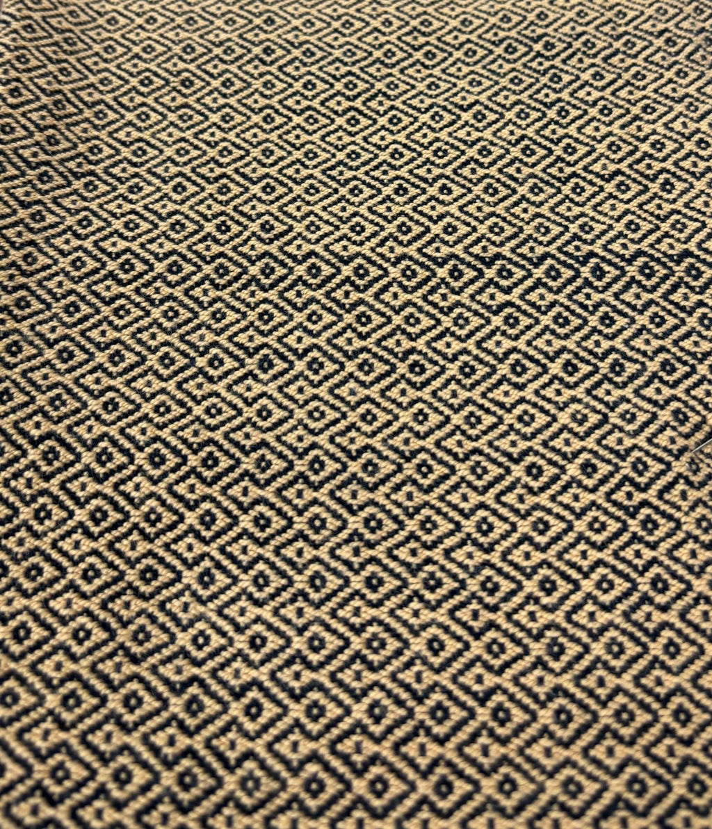 Patterned fabric with a geometric design in beige
