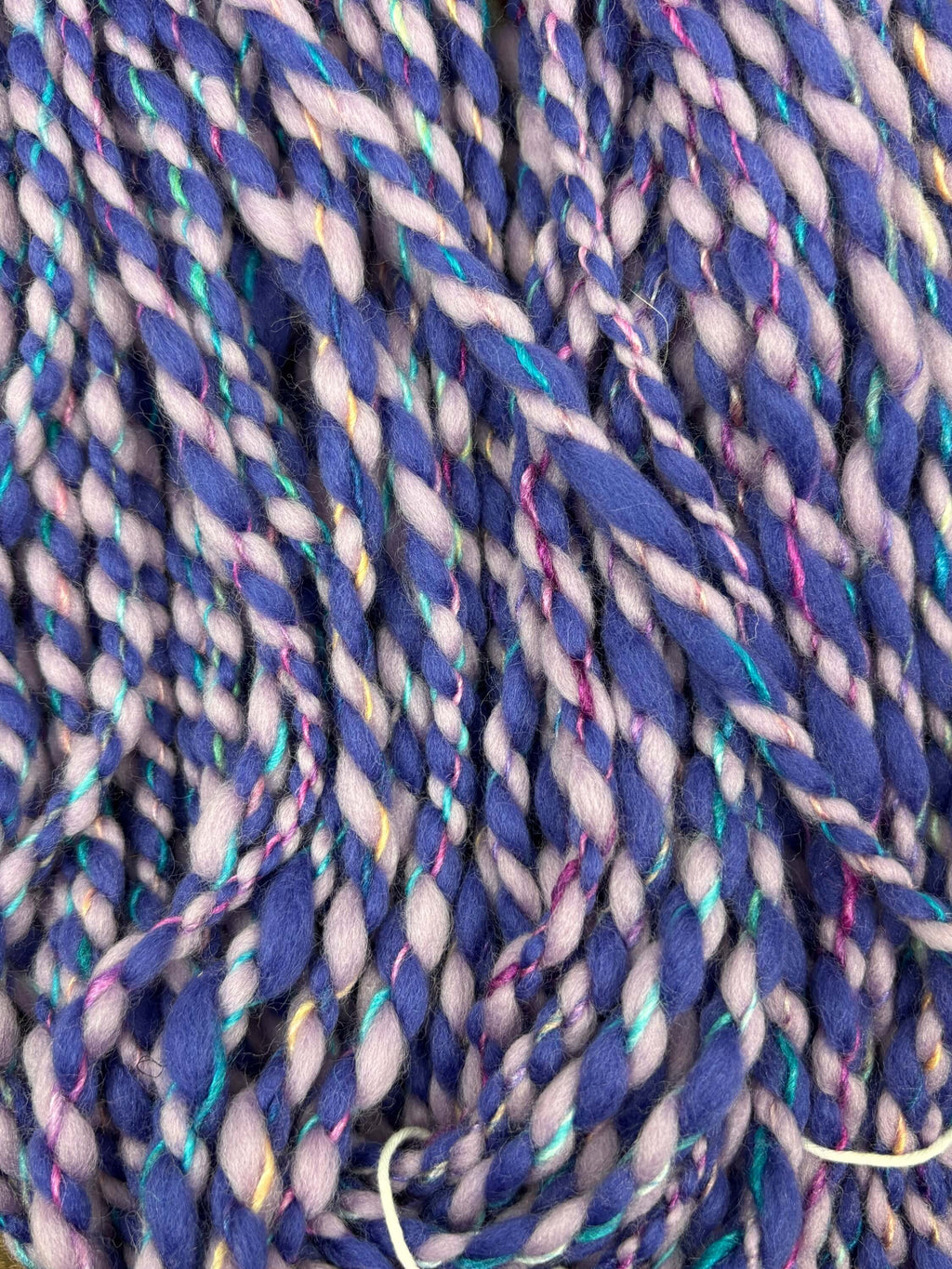 Close-up of dark purple and light purple twisted yarn